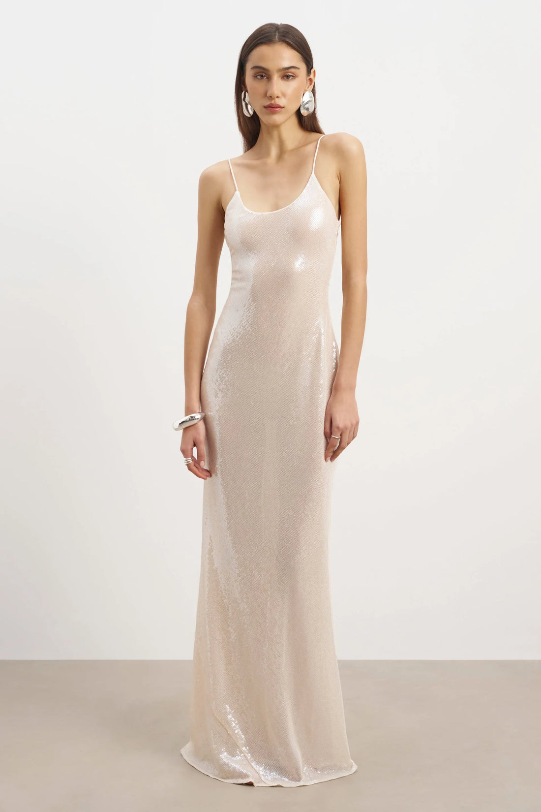 Ivory sequin camisole maxi dress with thin straps and flowing silhouette — Because of Alice | Endless UAE