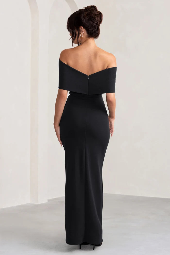 Woman wearing black off-shoulder maxi dress with bow detail from back view — Club L London | Endless UAE