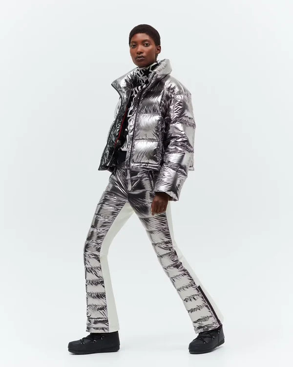 Model wearing metallic silver puffer jacket and matching pants against white background — Perfect moment | Endless UAE