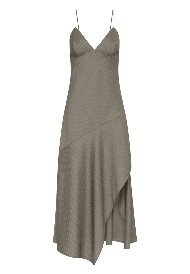 Woman wearing grey pinstriped asymmetric slip dress with thin straps and high slit — St Agni | Endless UAE