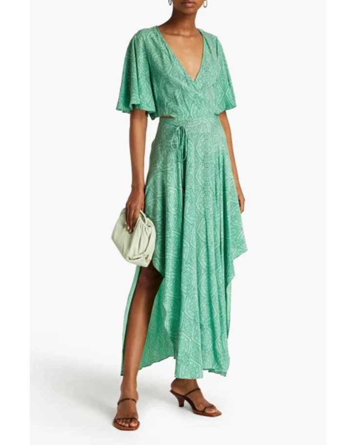 Woman wearing green printed maxi dress with flutter sleeves and back cutout detail — Maje | Endless UAE