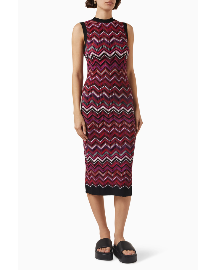 Woman wearing burgundy sequin zigzag midi dress with black trim and platform slides — Missoni | Endless UAE
