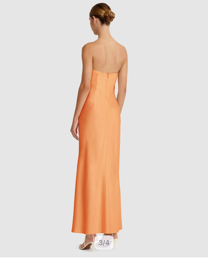 Woman wearing orange strapless maxi dress with ruching detail — Significant Other | Endless UAE