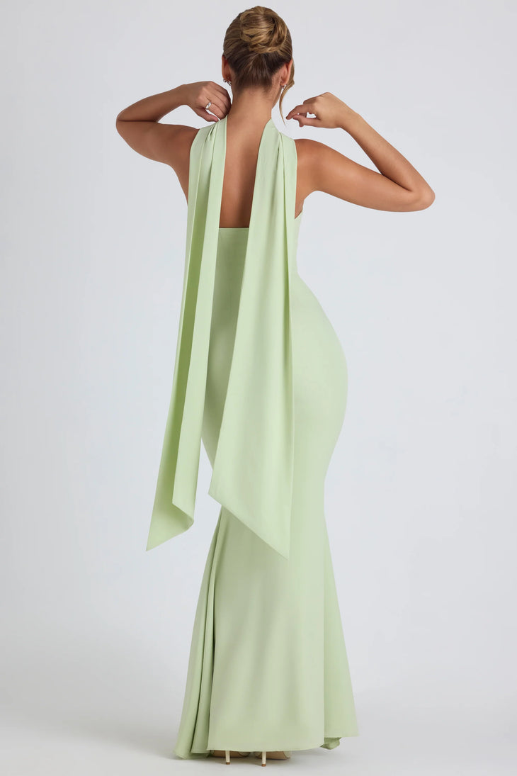 Woman wearing pale green strapless gown with flowing scarf detail — Oh Polly | Endless UAE