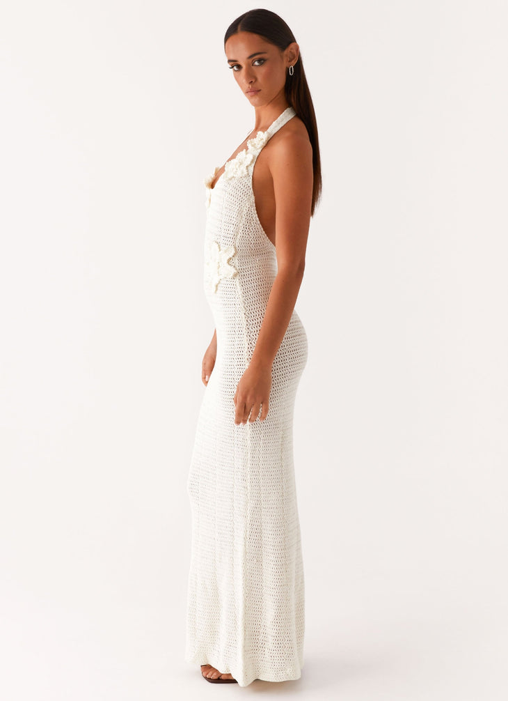 Woman wearing cream crochet halter maxi dress with floral appliqués — Peppermayo | Endless UAE