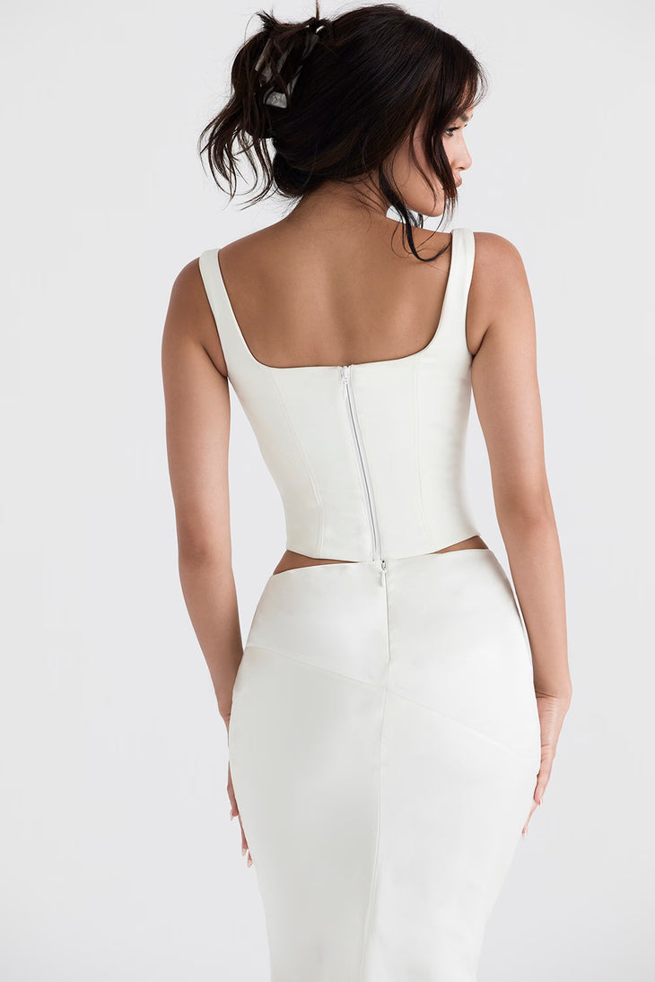 Woman wearing white satin longline corset with cutout sides and square neckline — House of CB | Endless UAE
