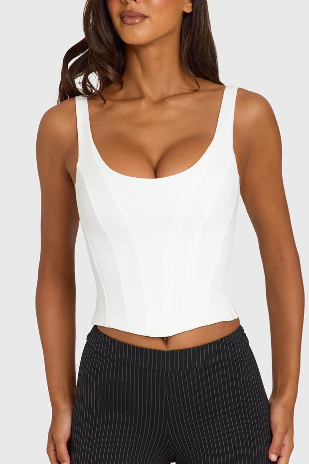 White sleeveless scoop neck corset top paired with black ribbed capri leggings — Oh Polly | Endless UAE