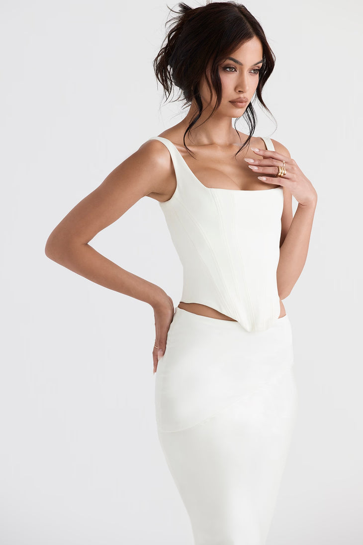 Woman wearing white satin longline corset with cutout sides and square neckline — House of CB | Endless UAE