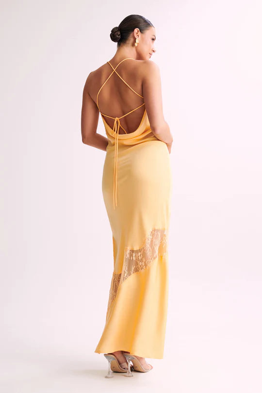 Woman wearing yellow Chandra Lace Dress with cowl neckline and lace side cutout — Meshki | Endless UAE