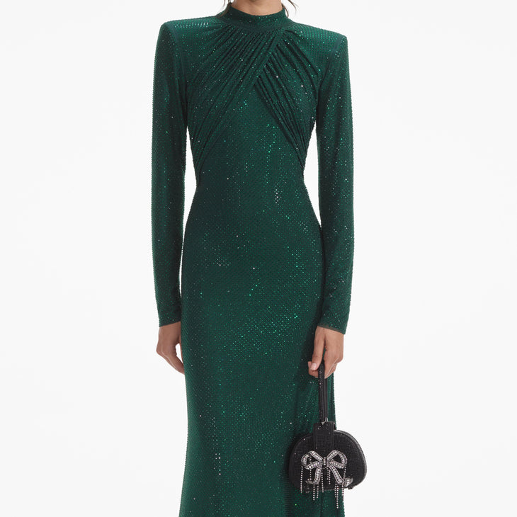 Woman wearing a forest green rhinestone mesh midi dress with long sleeves — Self-portrait | Endless UAE