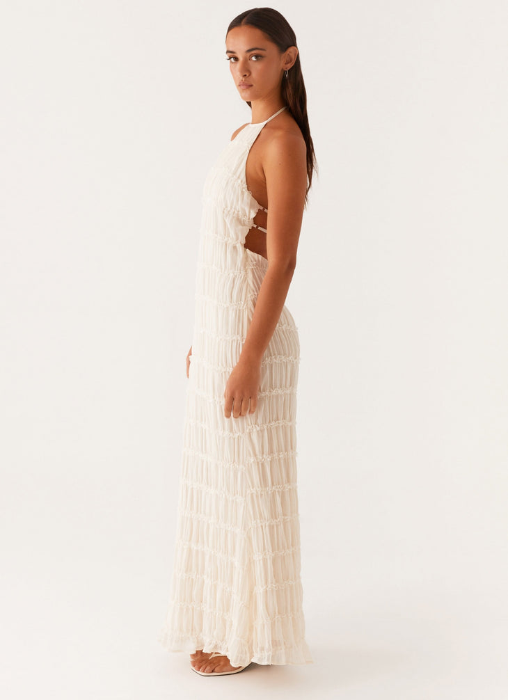 Woman wearing white pleated halter maxi dress in modern interior space — Peppermayo | Endless UAE