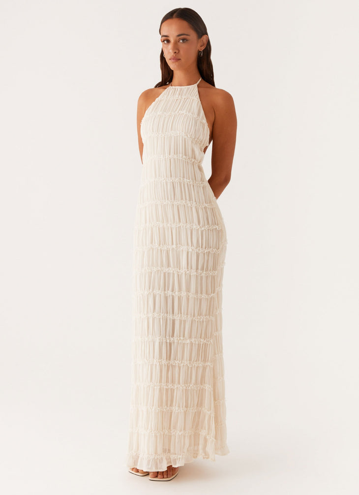 Woman wearing white pleated halter maxi dress in modern interior space — Peppermayo | Endless UAE