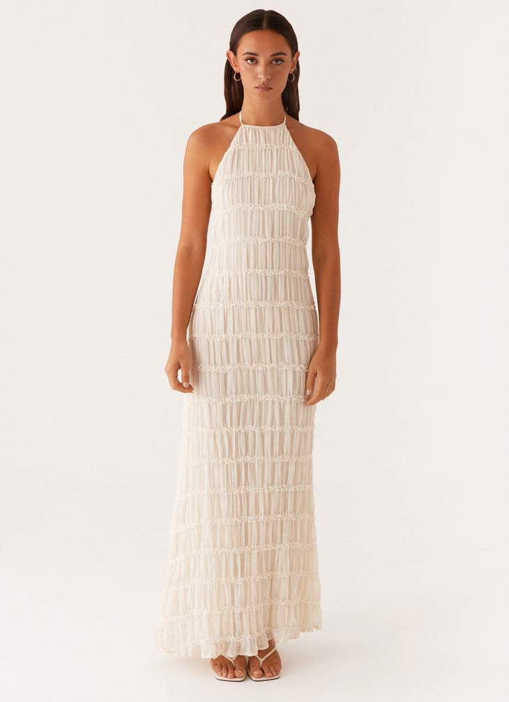 Woman wearing white pleated halter maxi dress in modern interior space — Peppermayo | Endless UAE