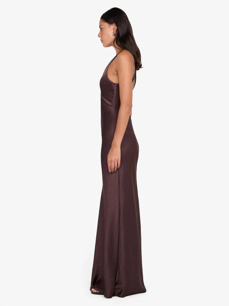Woman wearing burgundy V-neck sleeveless maxi dress with flowing fabric — Bec & Bridge | Endless UAE