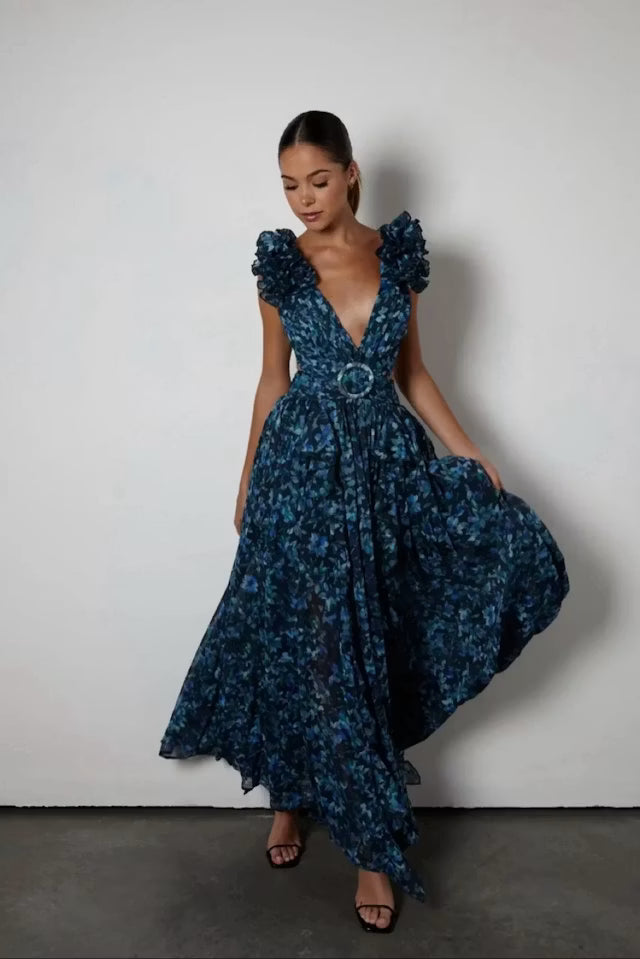 Woman wearing blue patterned Midnight Cassini dress with ruffled shoulders — Anne Louise Boutique | Endless UAE