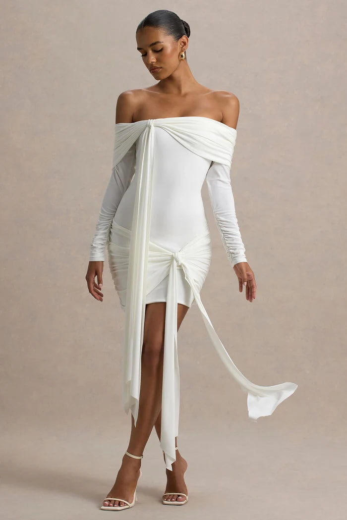 Woman wearing white Bardot wrap mini dress with off-shoulder design and long sleeves — Club L London | Endless UAE