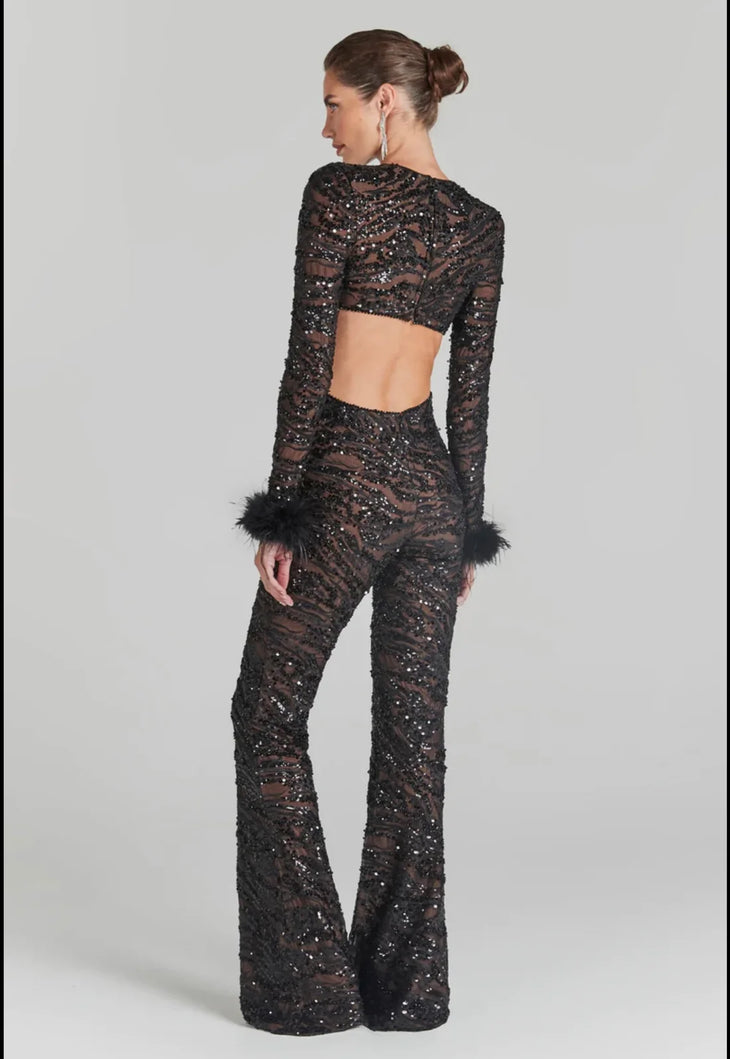 Black sequin jumpsuit with cutout details and feathered cuffs — Nadine Merabi | Endless UAE