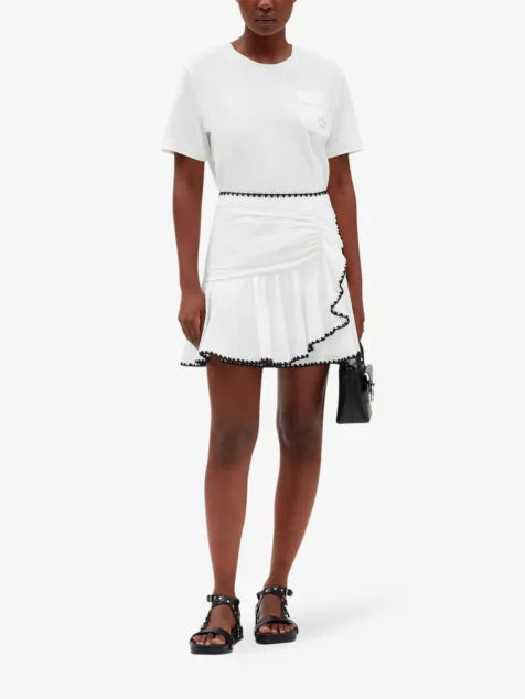 White cotton mini skirt with black embroidered ruffle trim — Claudie Pierlot | Endless UAE