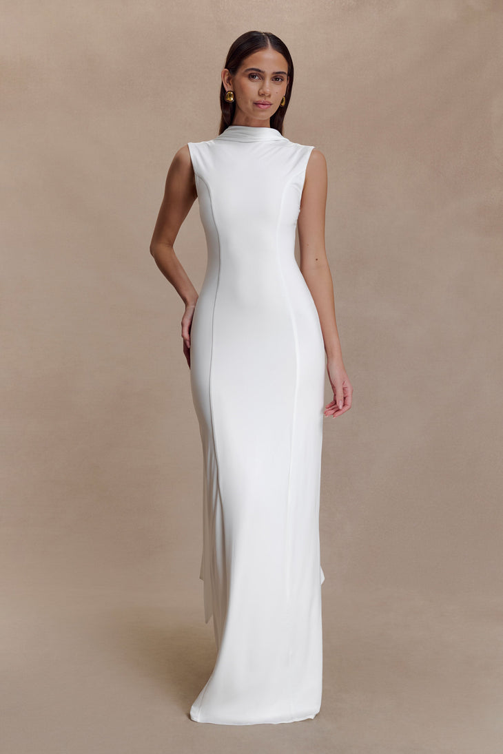 Woman modeling white sleeveless turtleneck maxi dress with flowing fabric — Meshki | Endless UAE