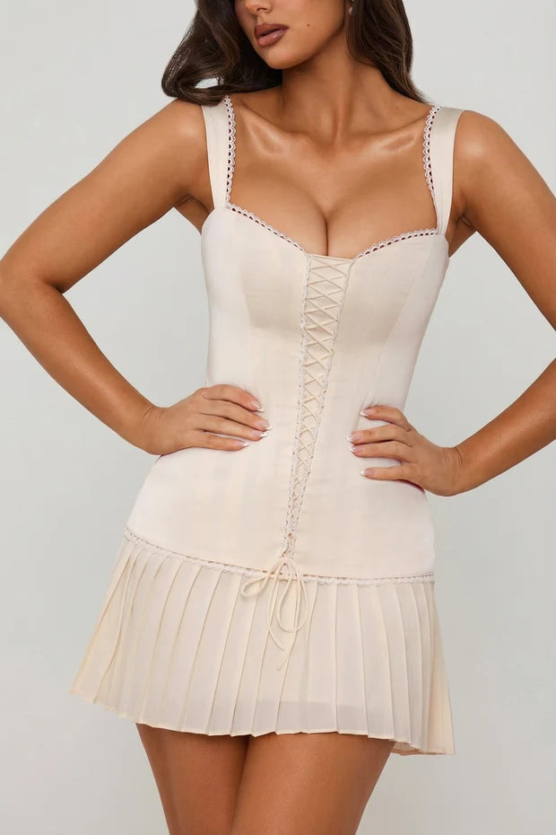 Cream lace-up corset mini dress with pleated skirt detail — Oh Polly | Endless UAE