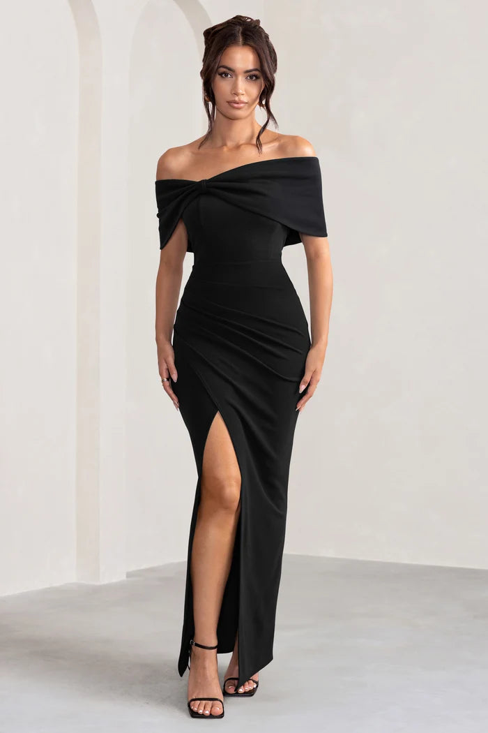 Woman wearing black off-shoulder maxi dress with bow detail from back view — Club L London | Endless UAE