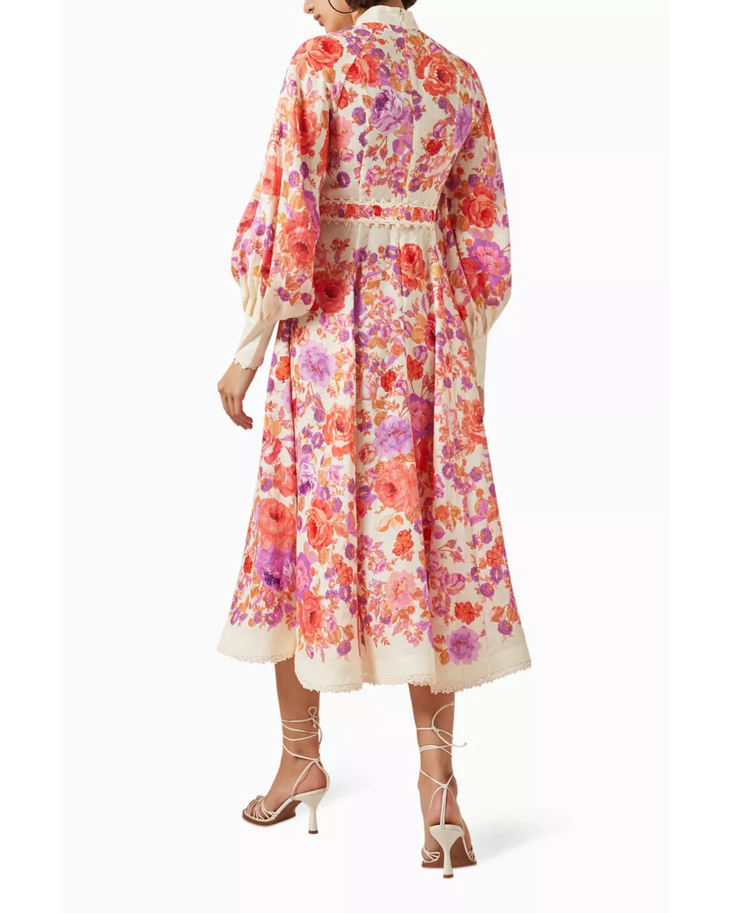 Woman wearing a floral-print midi dress with cream trim and matching strappy sandals — Zimmermann | Endless UAE