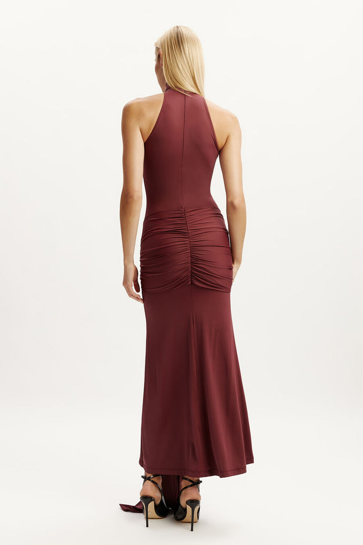 Woman wearing burgundy halterneck maxi dress with front tie detail — Chic Le Frique | Endless UAE