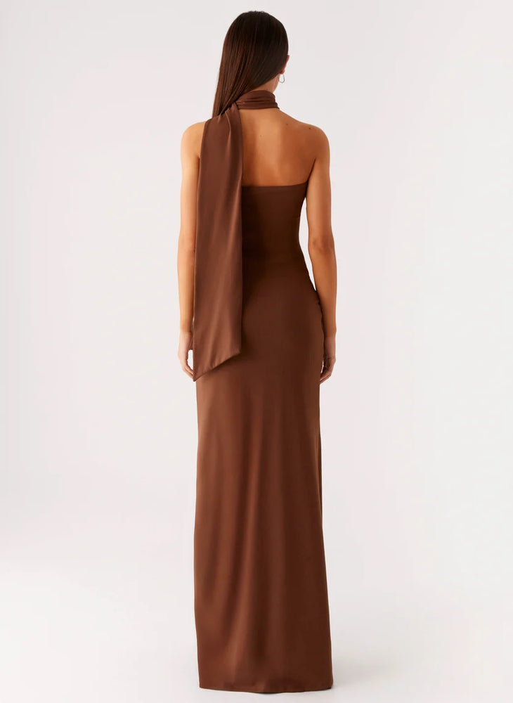 Woman wearing brown halter maxi dress with open back cutout detail — Peppermayo | Endless UAE