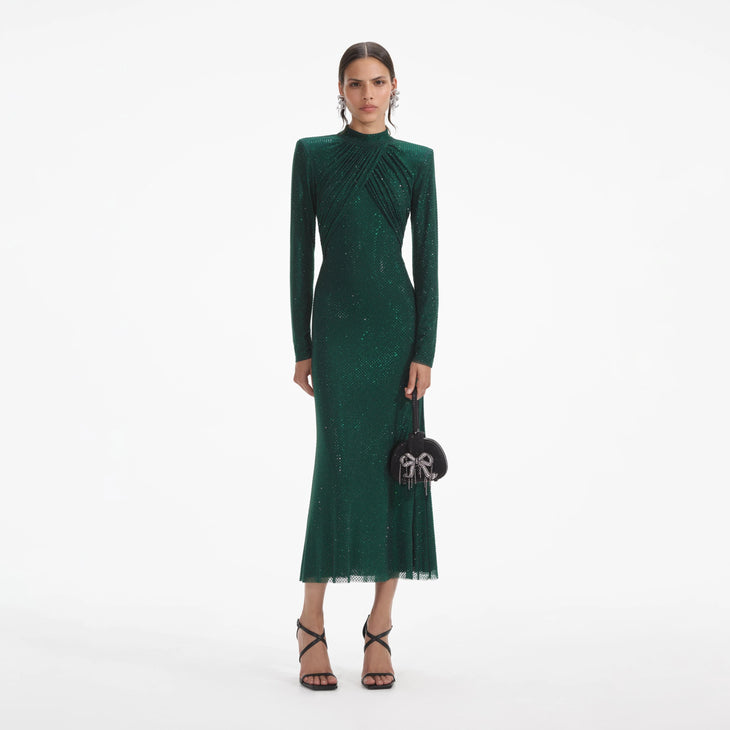Woman wearing a forest green rhinestone mesh midi dress with long sleeves — Self-portrait | Endless UAE