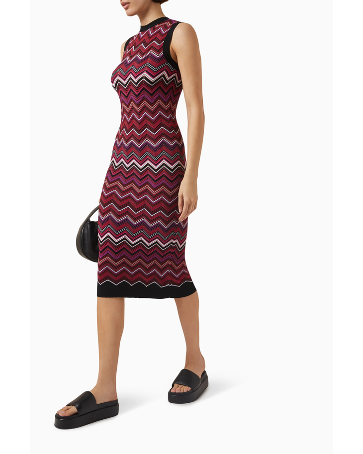 Woman wearing burgundy sequin zigzag midi dress with black trim and platform slides — Missoni | Endless UAE