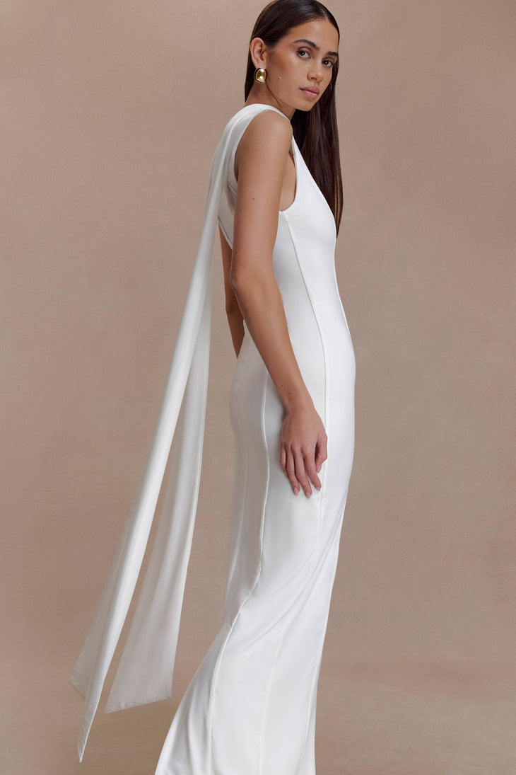 Woman modeling white sleeveless turtleneck maxi dress with flowing fabric — Meshki | Endless UAE