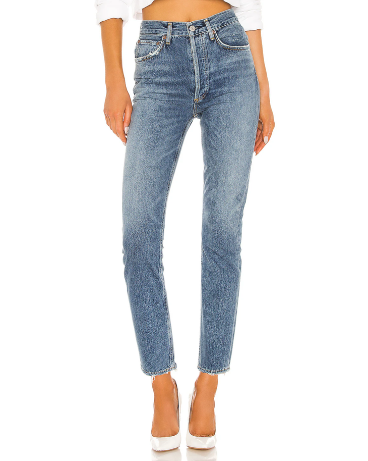 Woman wearing light wash high-rise straight crop jeans with white crop top and white platform shoes — Agolde | Endless UAE