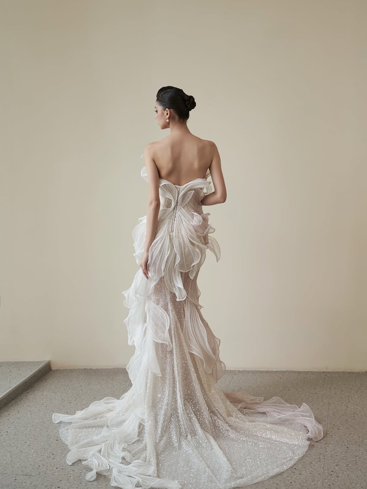 Ethereal off-shoulder gown with layered tulle and beaded embellishments in ivory — HACCHIC | Endless UAE