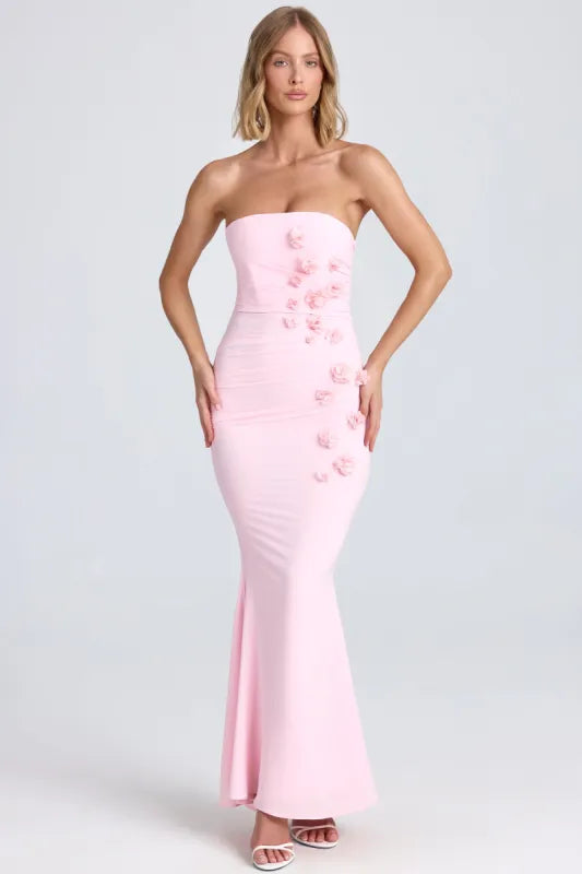 Woman wearing pink strapless maxi dress with floral appliqué details — Oh Polly | Endless UAE