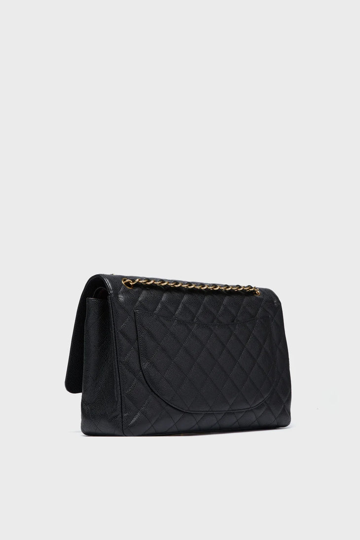 Black quilted leather maxi double flap shoulder bag with gold chain strap — Chanel | Endless UAE