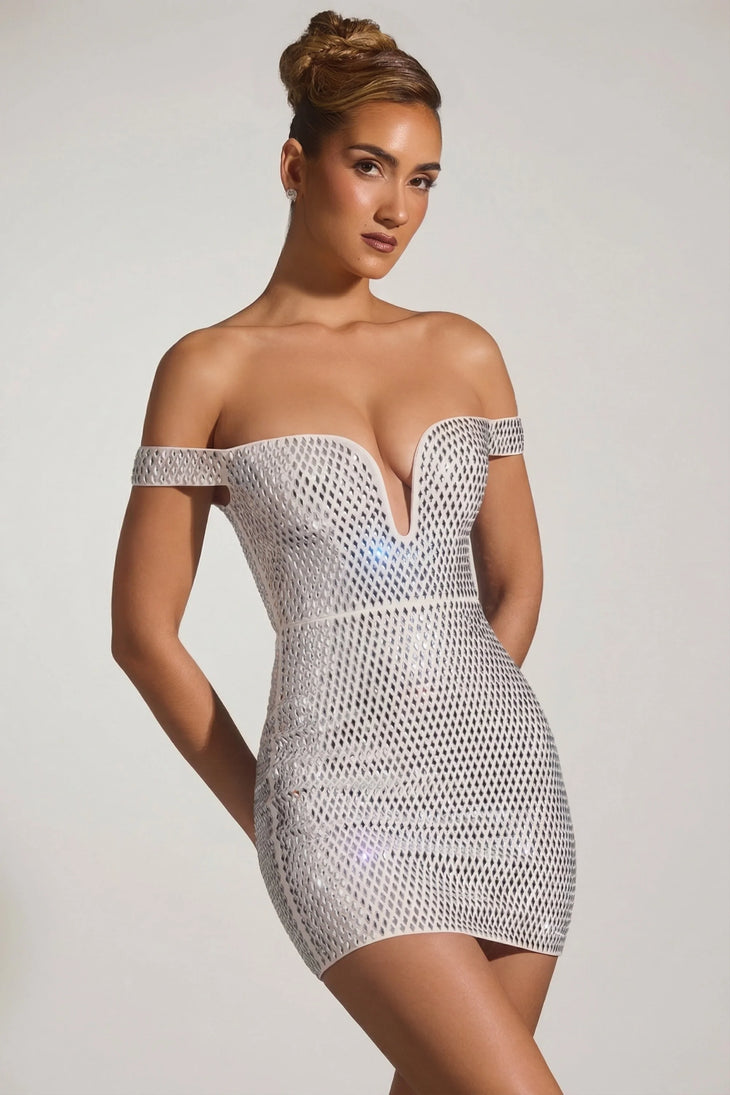 Woman wearing white embellished off-shoulder mini dress with metallic heels — Oh Polly | Endless UAE