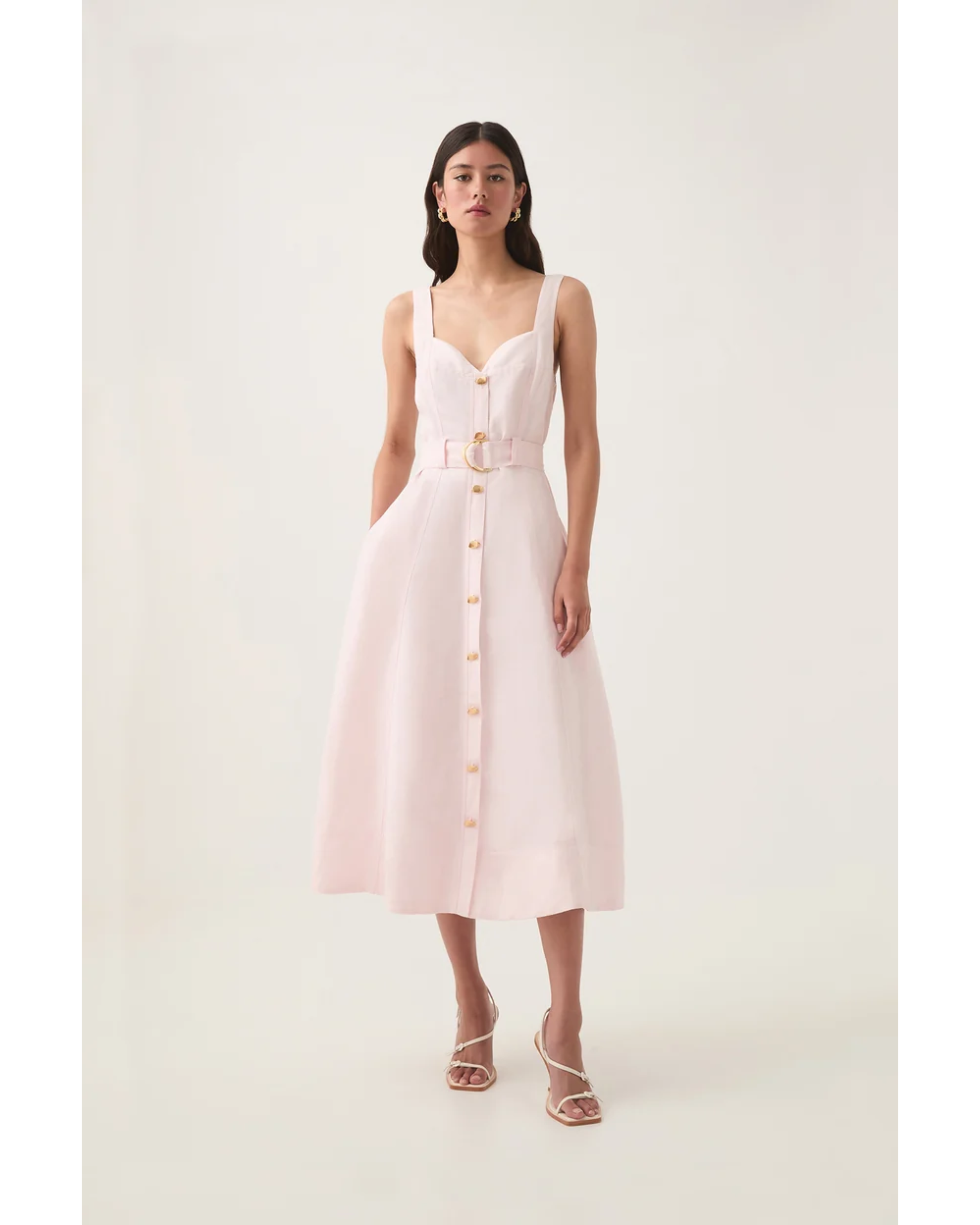 Pale pink sleeveless midi dress with sweetheart neckline, gold button front, and gold belt — Aje | Endless UAE