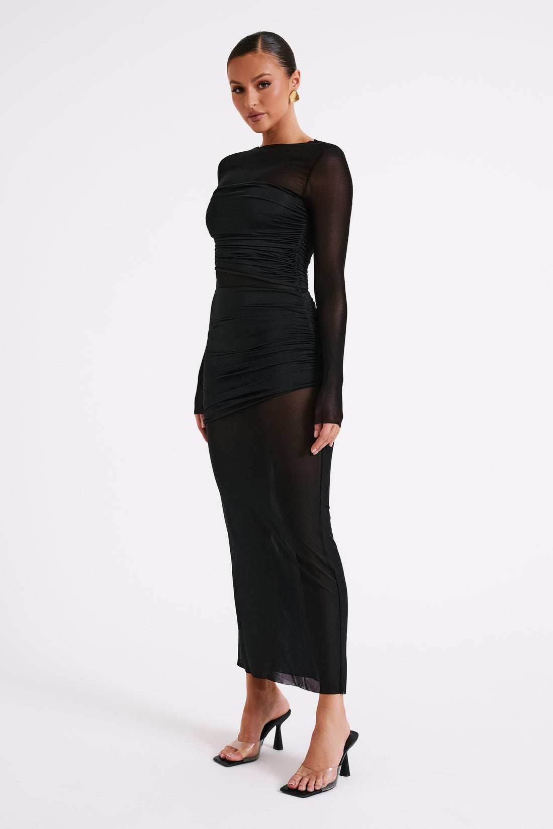 Woman wearing black mesh and nylon maxi dress with long sleeves and ruching — Meshki | Endless UAE