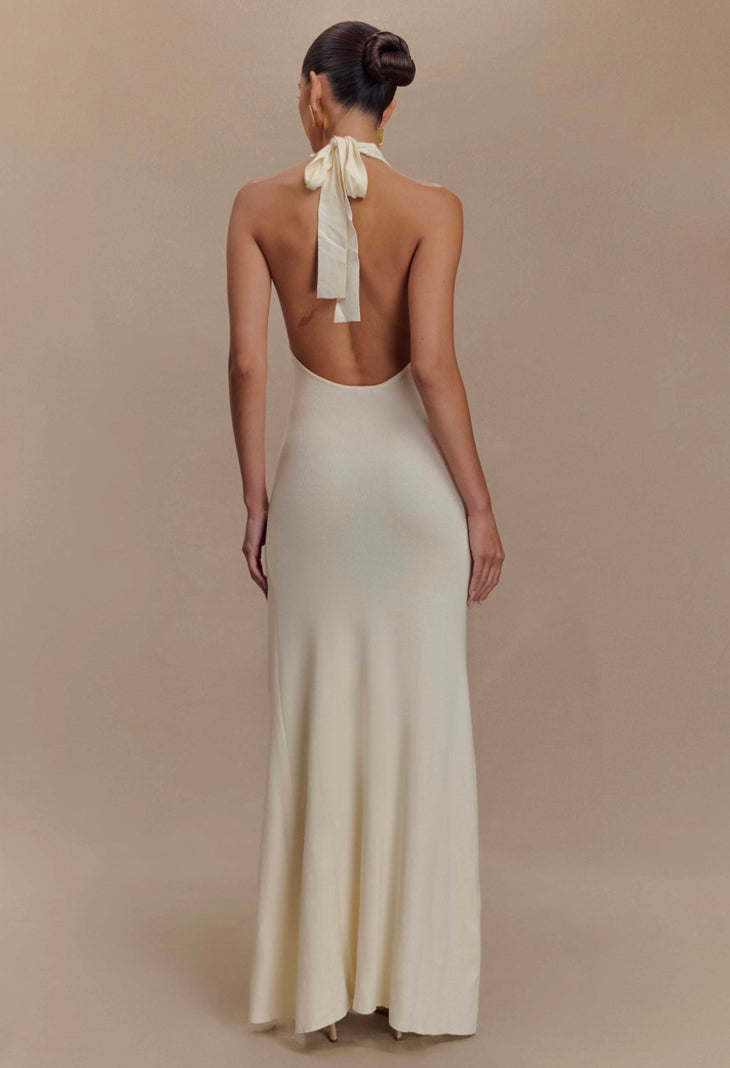 Woman wearing cream halter maxi dress with red rose embroidery and high slit — Meshki | Endless UAE