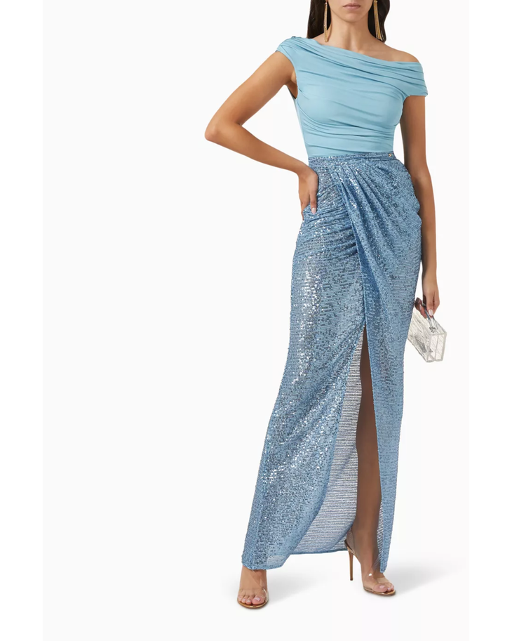 Woman wearing light blue off-shoulder top with sequined blue maxi skirt — Elisabetta Franchi | Endless UAE