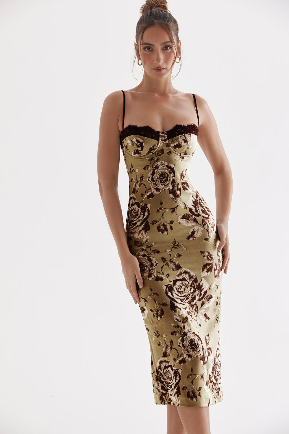 Woman wearing beige floral midi dress with black lace trim and thin straps — House of CB | Endless UAE