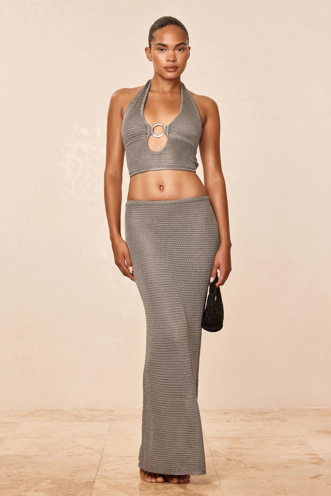 Woman wearing steel gray halter crop top with ring detail — Monday Swimwear | Endless UAE