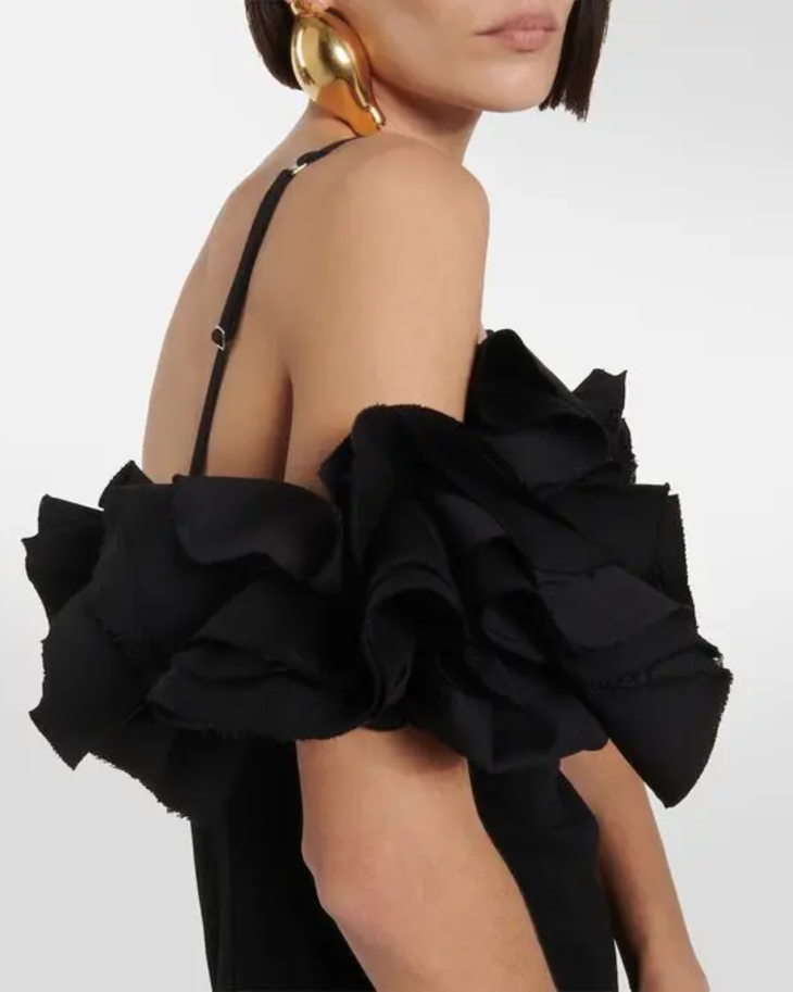 Black mini dress with bow detail and open back, styled with heels and handbag — Jacquemus | Endless UAE