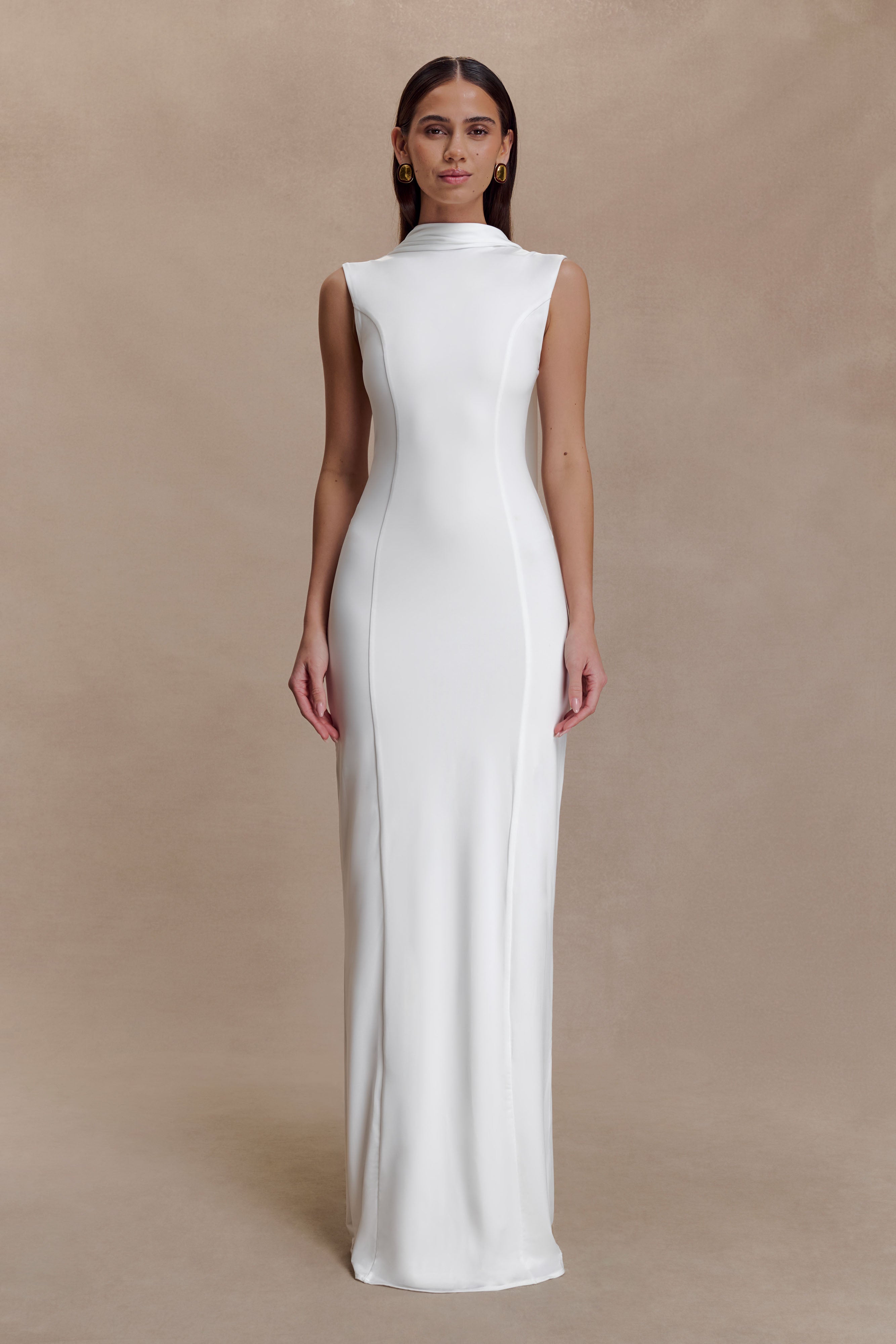 Woman modeling white sleeveless turtleneck maxi dress with flowing fabric — Meshki | Endless UAE