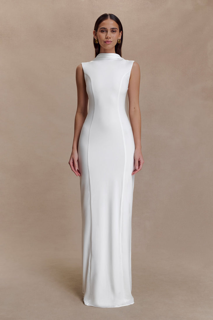 Woman modeling white sleeveless turtleneck maxi dress with flowing fabric — Meshki | Endless UAE