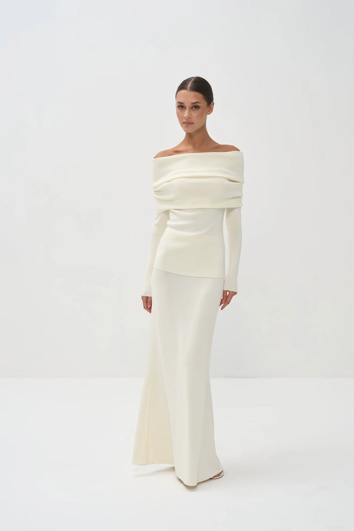 Cream off-shoulder knit top with long sleeves paired with matching maxi skirt — Nora The Label | Endless UAE