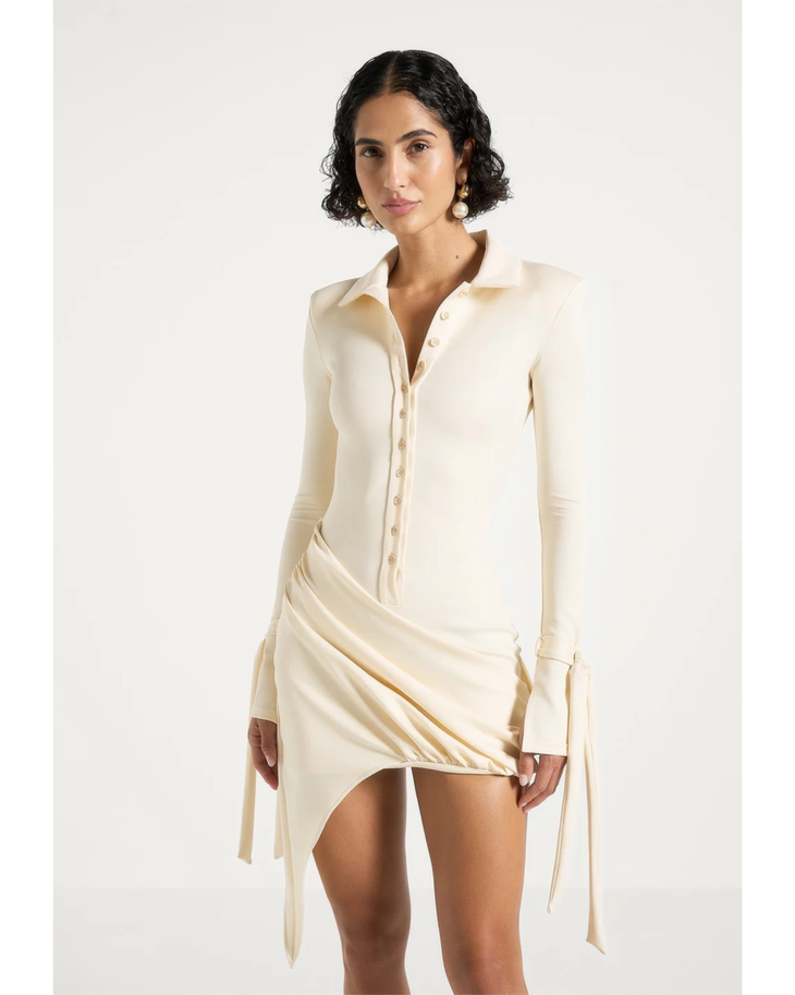 Cream draped asymmetric mini dress with long sleeves and tie detail — Maniere De Voir | Endless UAE