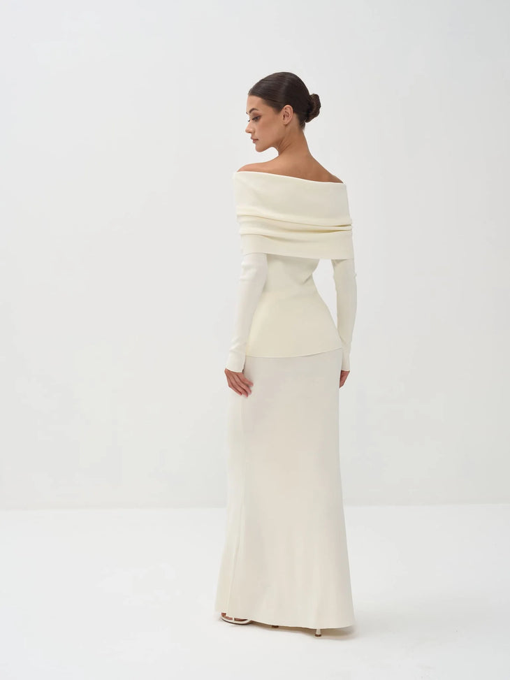 Cream off-shoulder knit top with long sleeves paired with matching maxi skirt — Nora The Label | Endless UAE