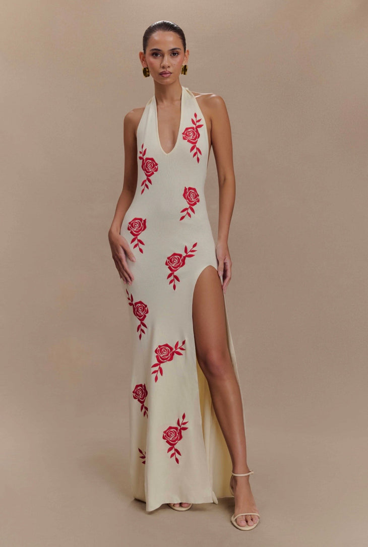 Woman wearing cream halter maxi dress with red rose embroidery and high slit — Meshki | Endless UAE