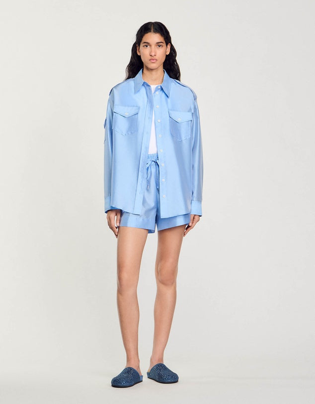 Light blue oversized shirt with chest pockets worn open — Sandro | Endless UAE